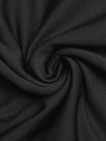 Close-up of black fabric with a swirl pattern