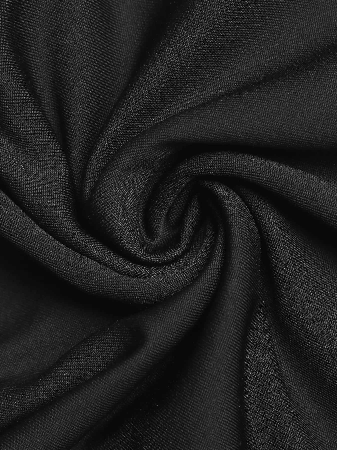 Close-up of black fabric with a swirl pattern