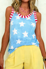 Woman wearing a sleeveless top with star pattern and yellow pants.