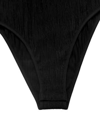 Close-up of black underwear on a white background