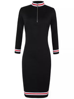 Black dress with red and white striped cuffs and collar on a white background