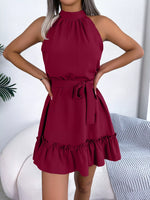 Red dress worn by a person with a white background