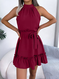 Red dress worn by a person with a white background