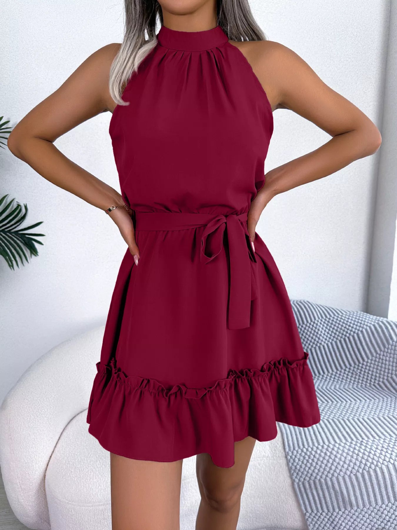 Red dress worn by a person with a white background