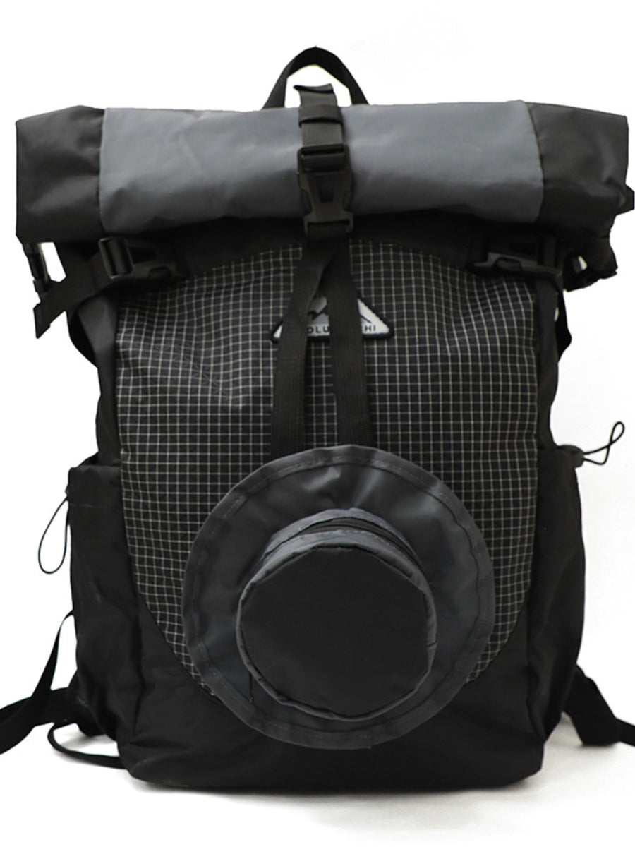Black and gray backpack with a roll-top design on a white background