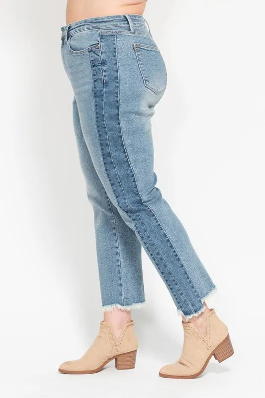 Light blue jeans worn by a person on a white background