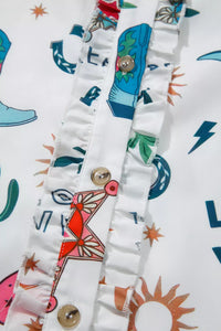 Close-up of colorful fabric with patterns and buttons on a white background