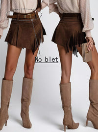 Brown suede skirt with fringe and matching knee-high boots on a plain background