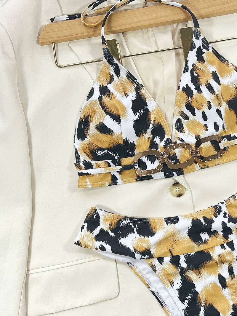 Leopard print bikini set on a hanger against a white background