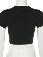 Black crop top on a mannequin against a white background