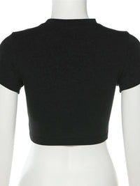 Black crop top on a mannequin against a white background