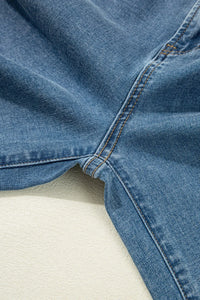 Close-up of blue denim fabric on a light background