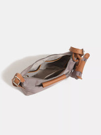 Gray bag with brown leather straps on a white background