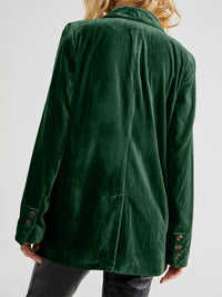 Green jacket worn by a person on a white background