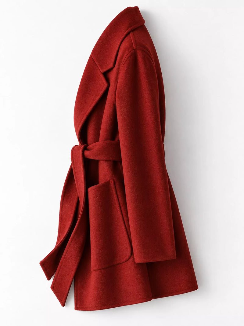 A red wool coat with a matching waist tie belt, shown from a side profile view against a plain white background.