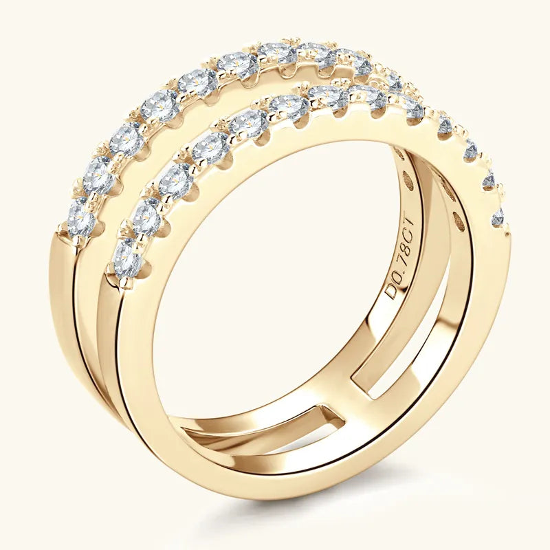 Gold ring with clear gemstones on a white background