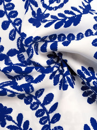 Blue floral pattern on white fabric