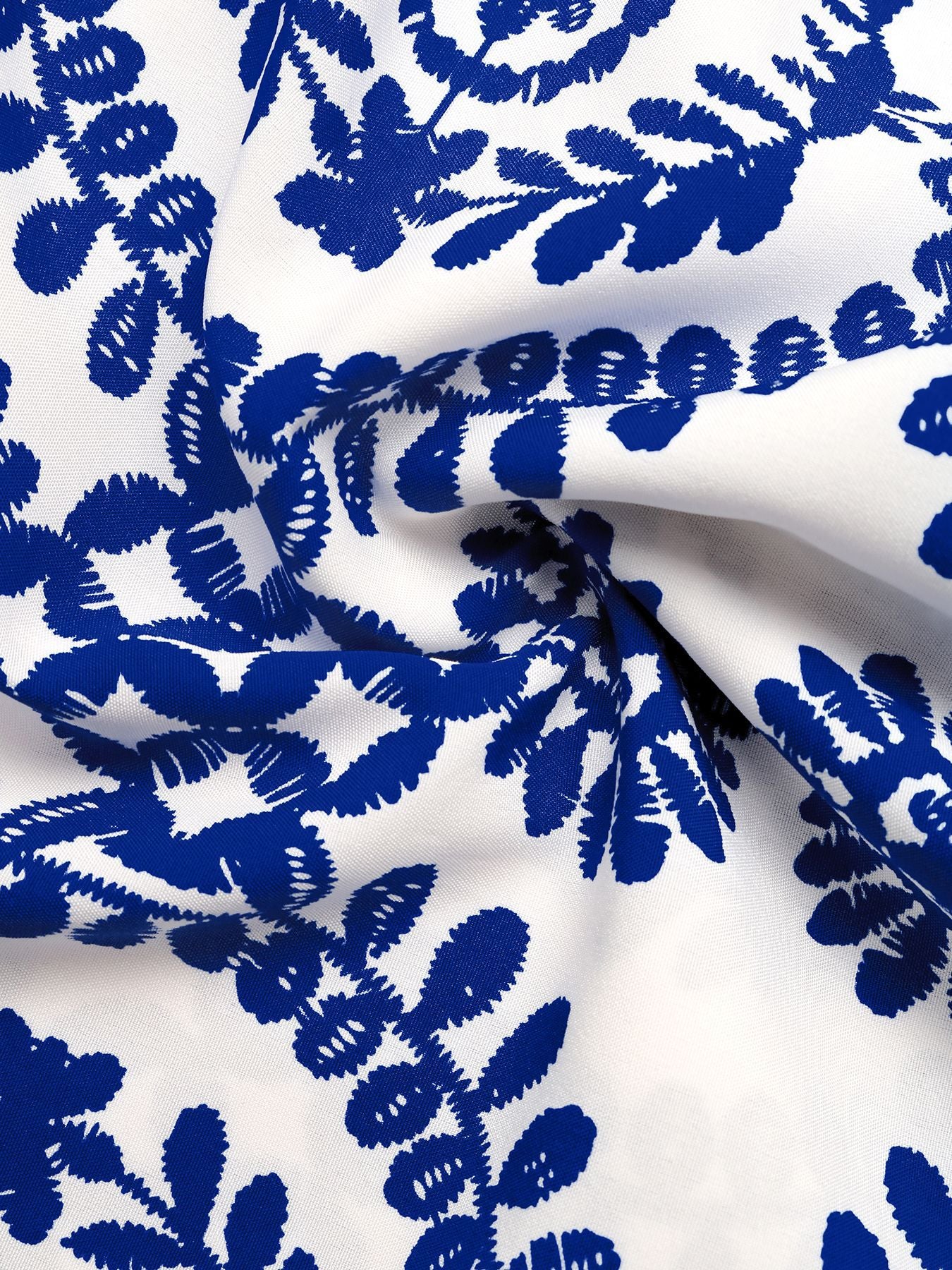 Blue floral pattern on white fabric