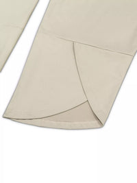 Close-up of beige fabric with a subtle pattern on a white background