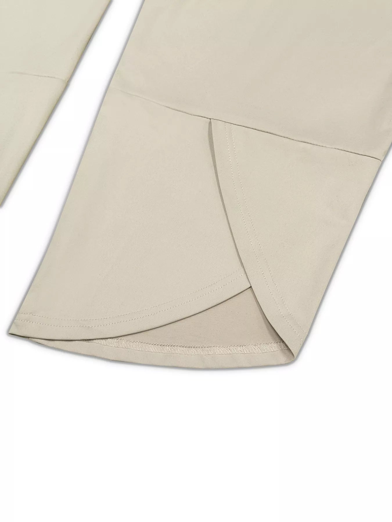 Close-up of beige fabric with a subtle pattern on a white background