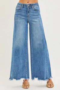 Blue wide-leg jeans on a white background