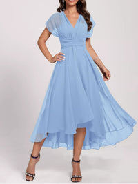 Woman wearing a light blue dress on a white background