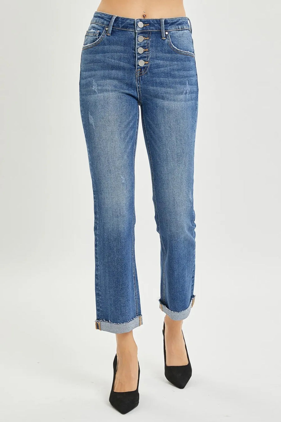Blue jeans with a button fly on a white background