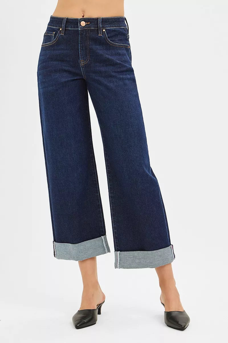 Dark blue wide-leg jeans on a white background