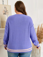 Person wearing a blue sweater with a white background