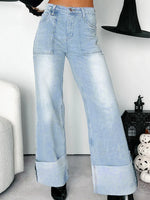 Light blue wide-leg jeans worn by a person indoors.
