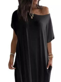 Woman wearing a black off-shoulder dress on a white background