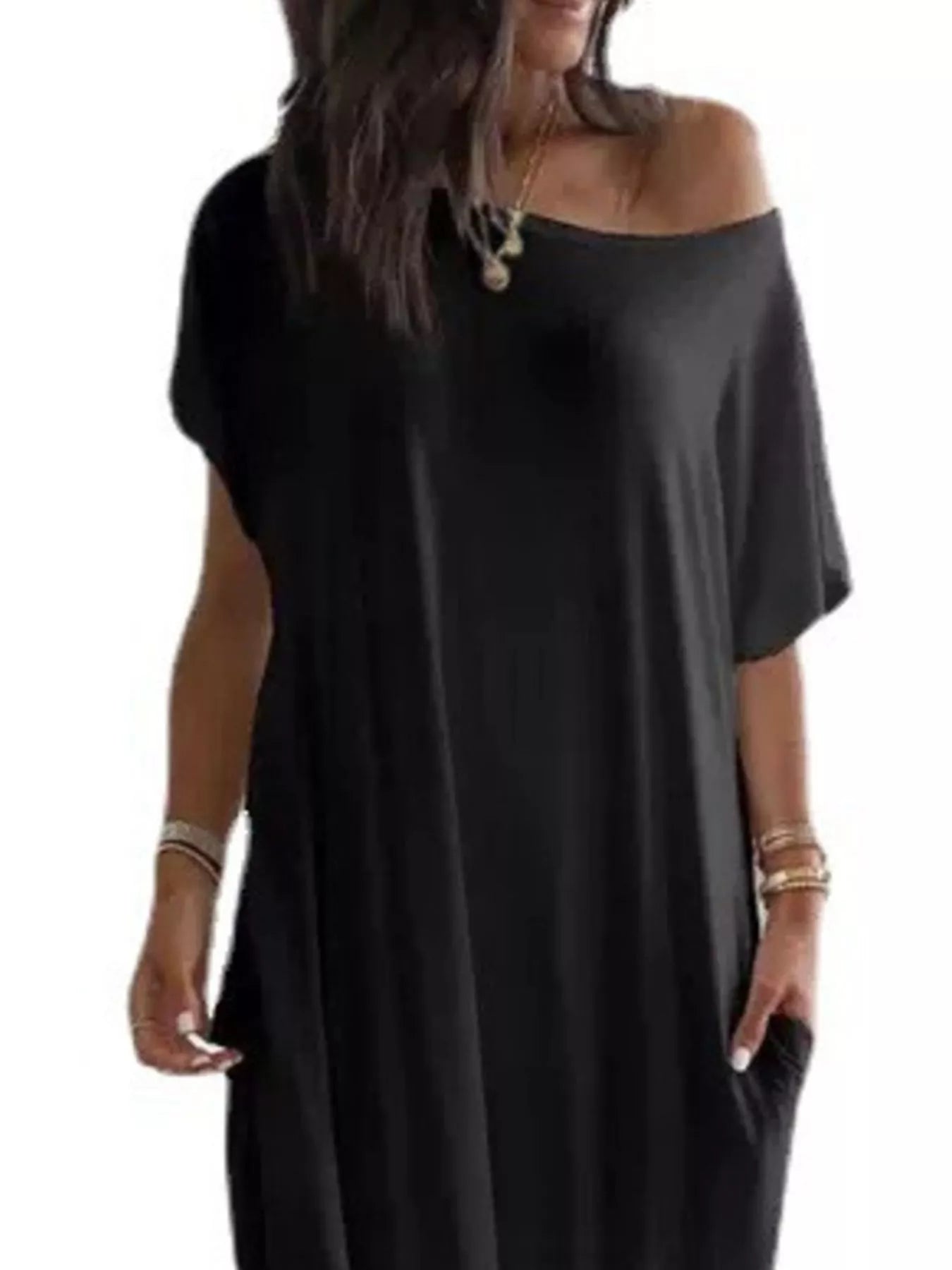 Woman wearing a black off-shoulder dress on a white background
