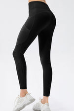 Black leggings worn by a person on a light gray background