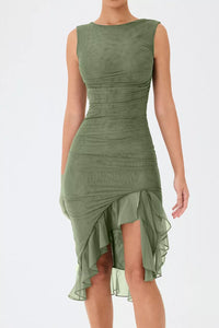 Green dress with a ruffled skirt on a white background