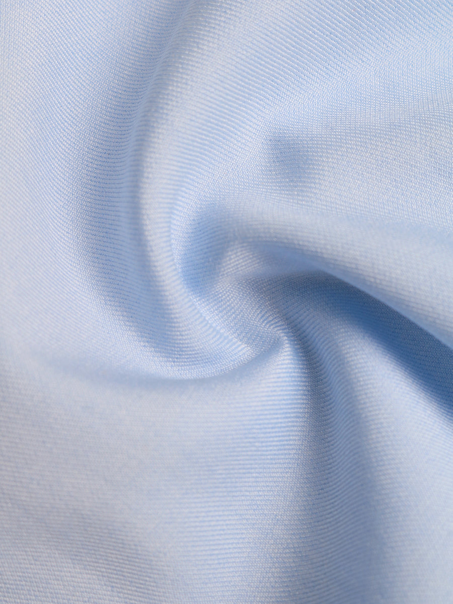 Close-up of light blue fabric with a subtle pattern
