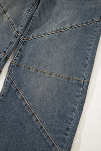 Close-up of a blue denim fabric with stitching details