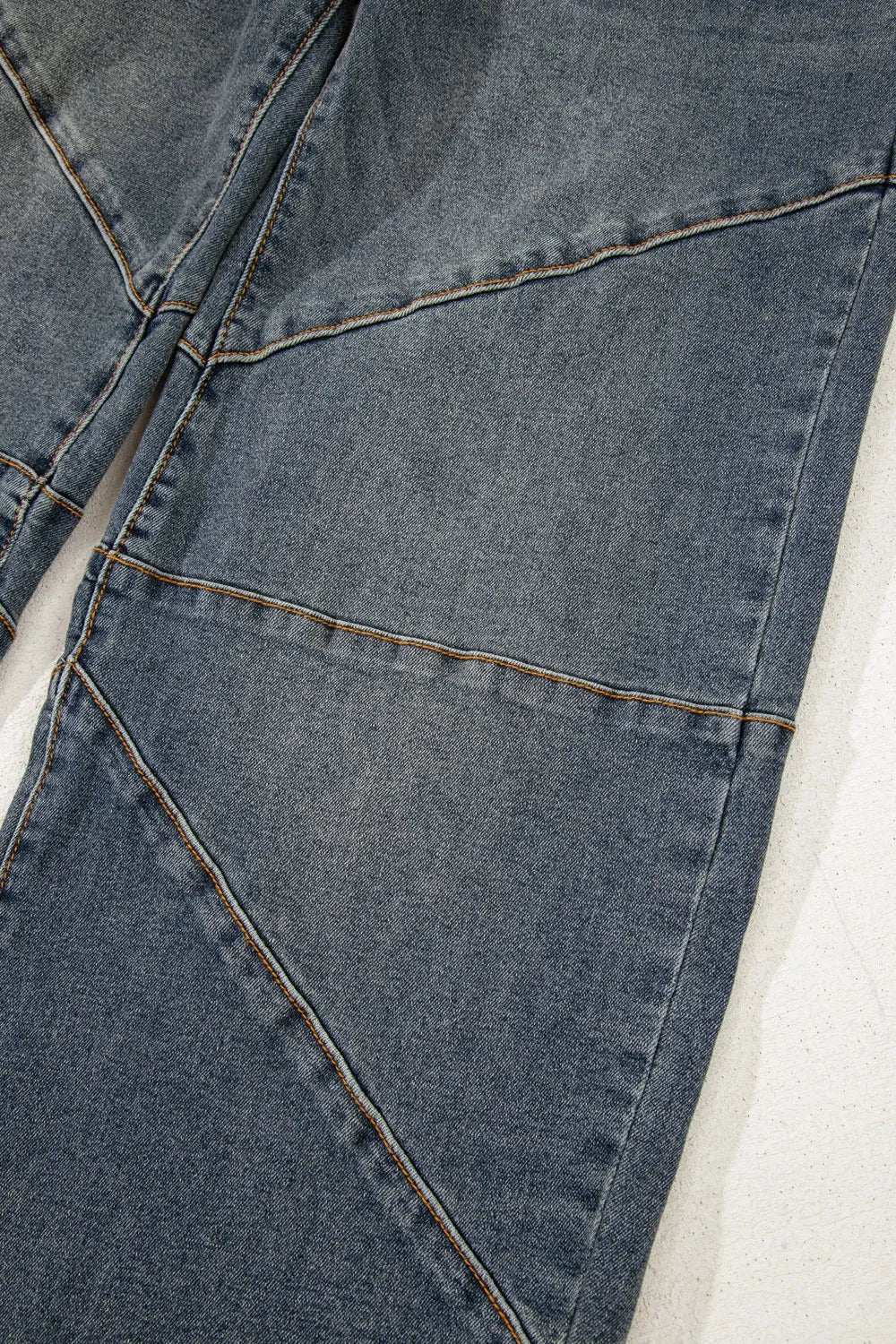 Close-up of a blue denim fabric with stitching details
