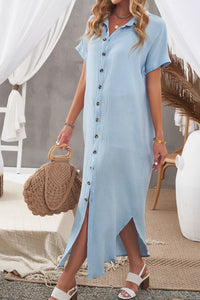 Woman wearing a light blue dress with a straw bag in an outdoor setting