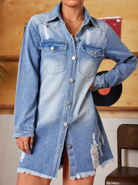 Denim shirt dress worn by a person with a wooden wall background
