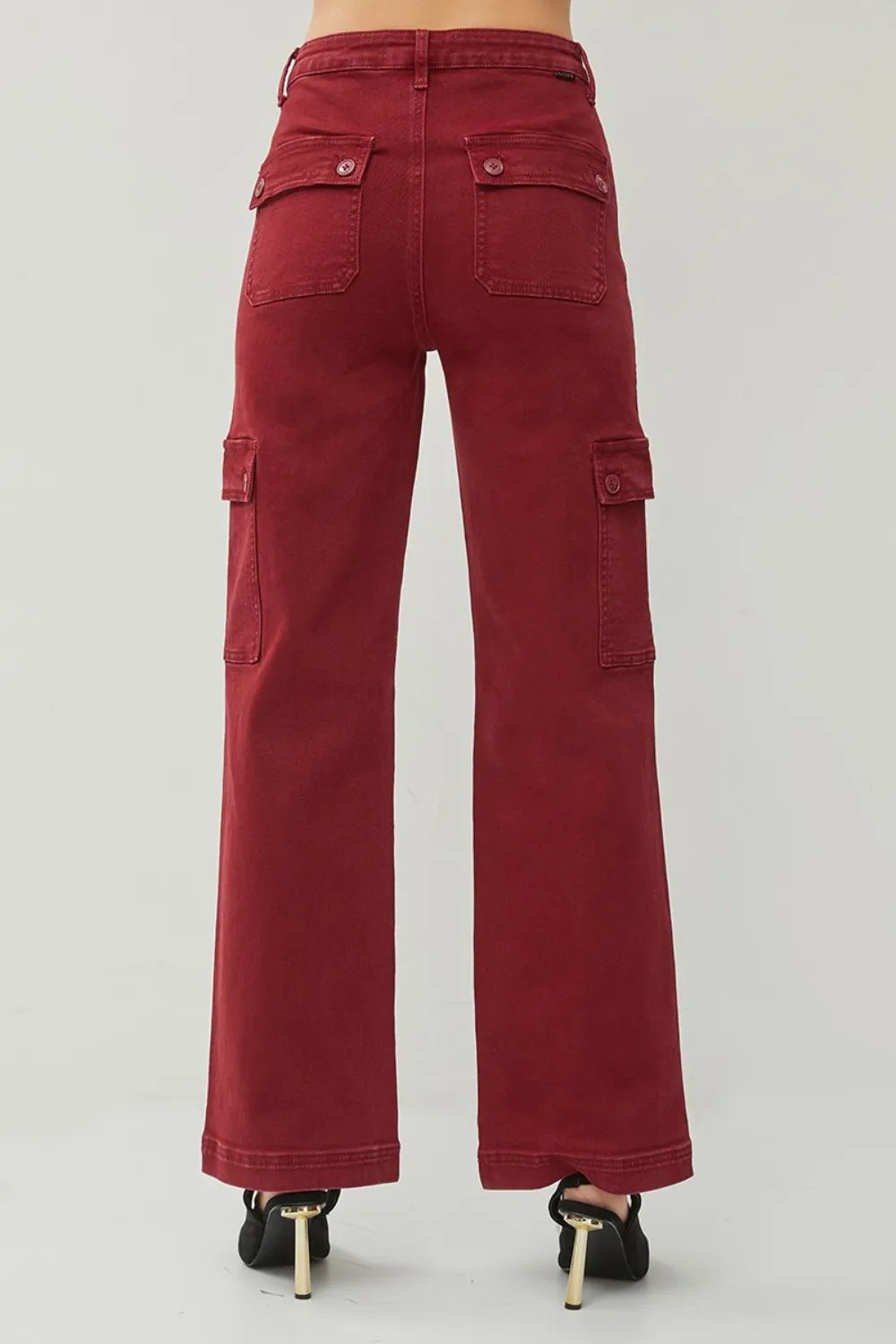 Red cargo pants on a plain background