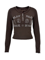 Brown long-sleeve shirt with text design on a white background