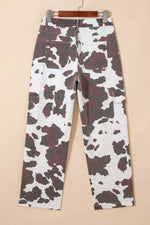 Cow print pants on a beige background