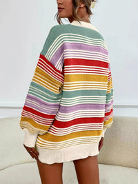 Multicolored striped sweater worn by a person on a neutral background