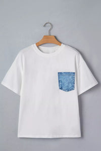 White t-shirt with a blue pocket on a hanger against a gray background