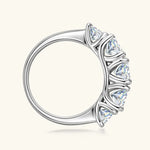 Silver ring with a clear gemstone on a white background