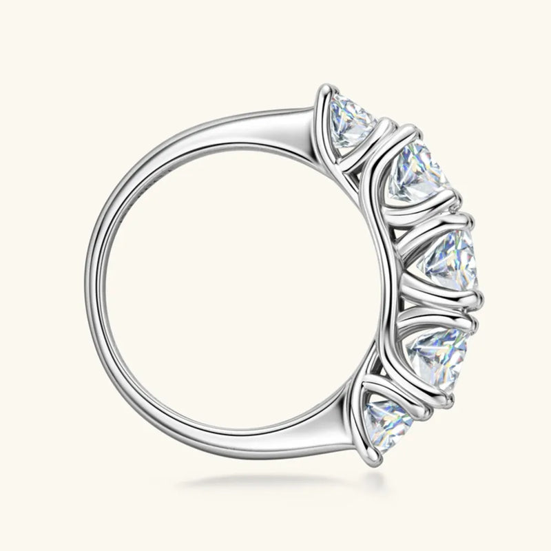 Silver ring with a clear gemstone on a white background