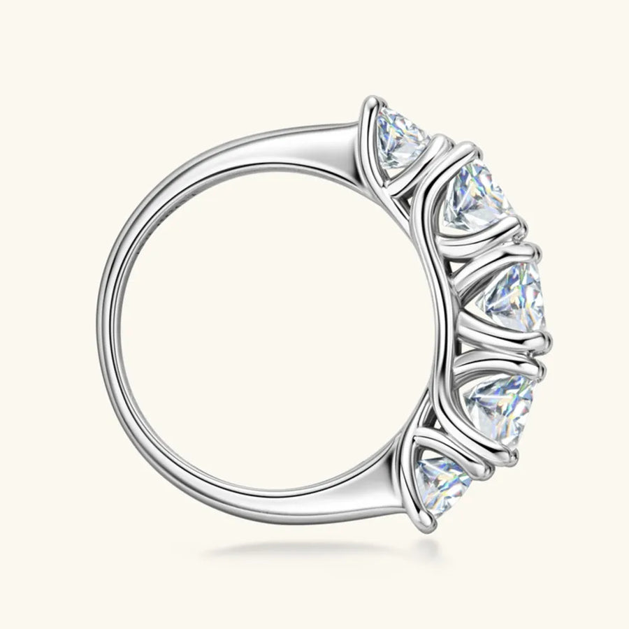 Silver ring with a clear gemstone on a white background