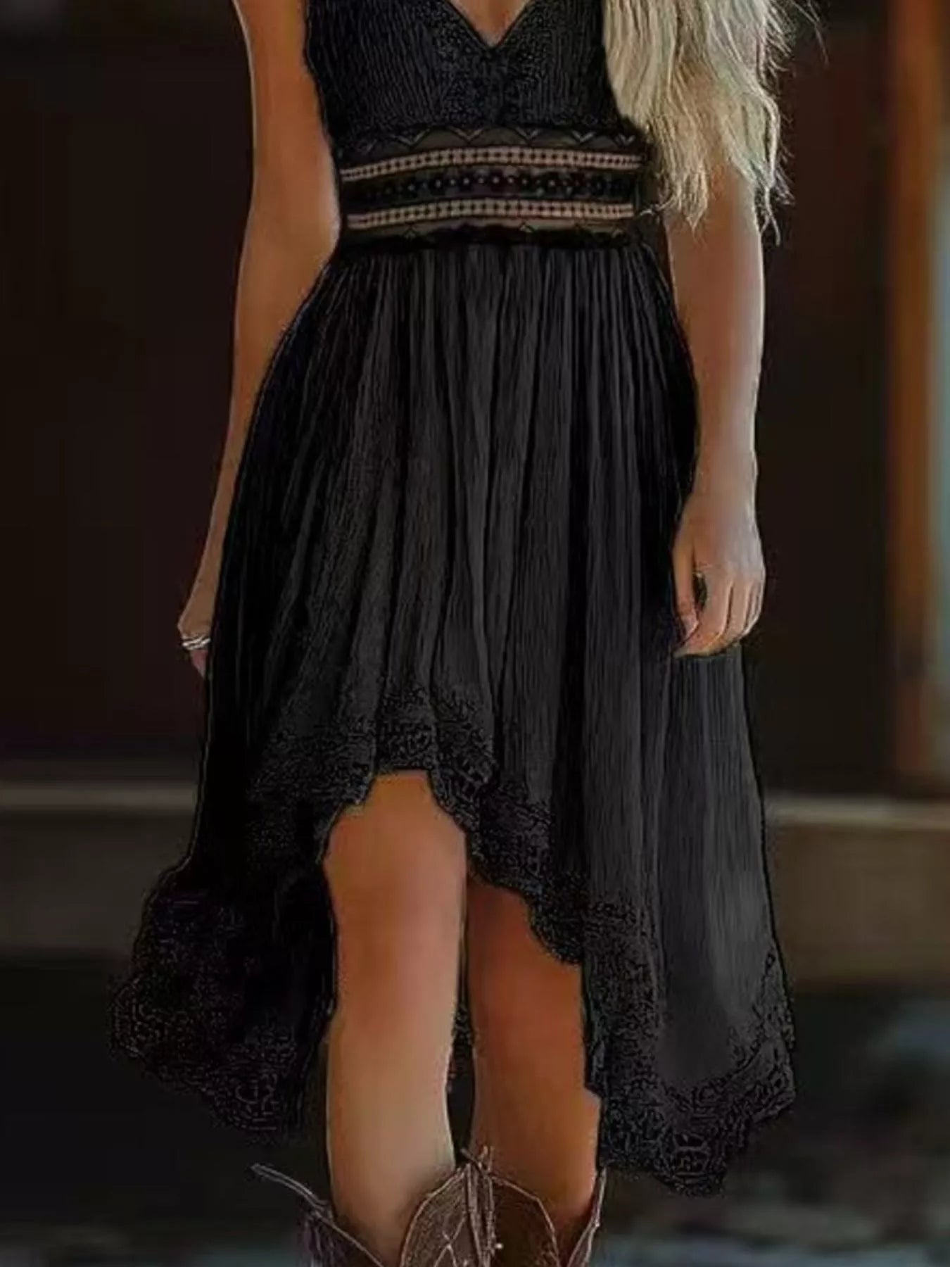 Black lace dress with a high-low hemline worn by a person.