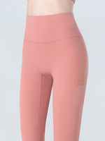 Pink leggings on a plain background