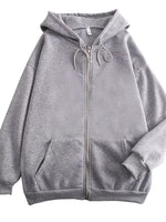 A light gray zip-up hoodie with a drawstring hood and front pockets, shown against a plain white background.